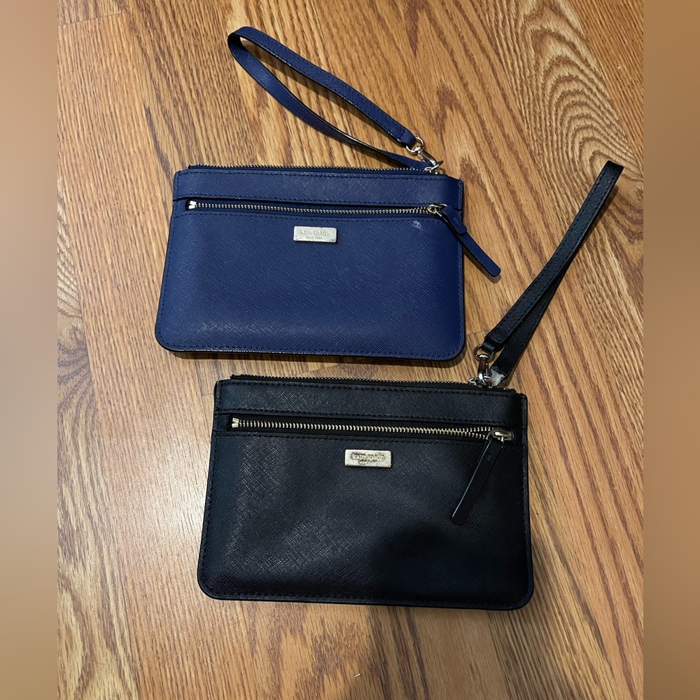 Kate Spade's black and blue wristlet pair.